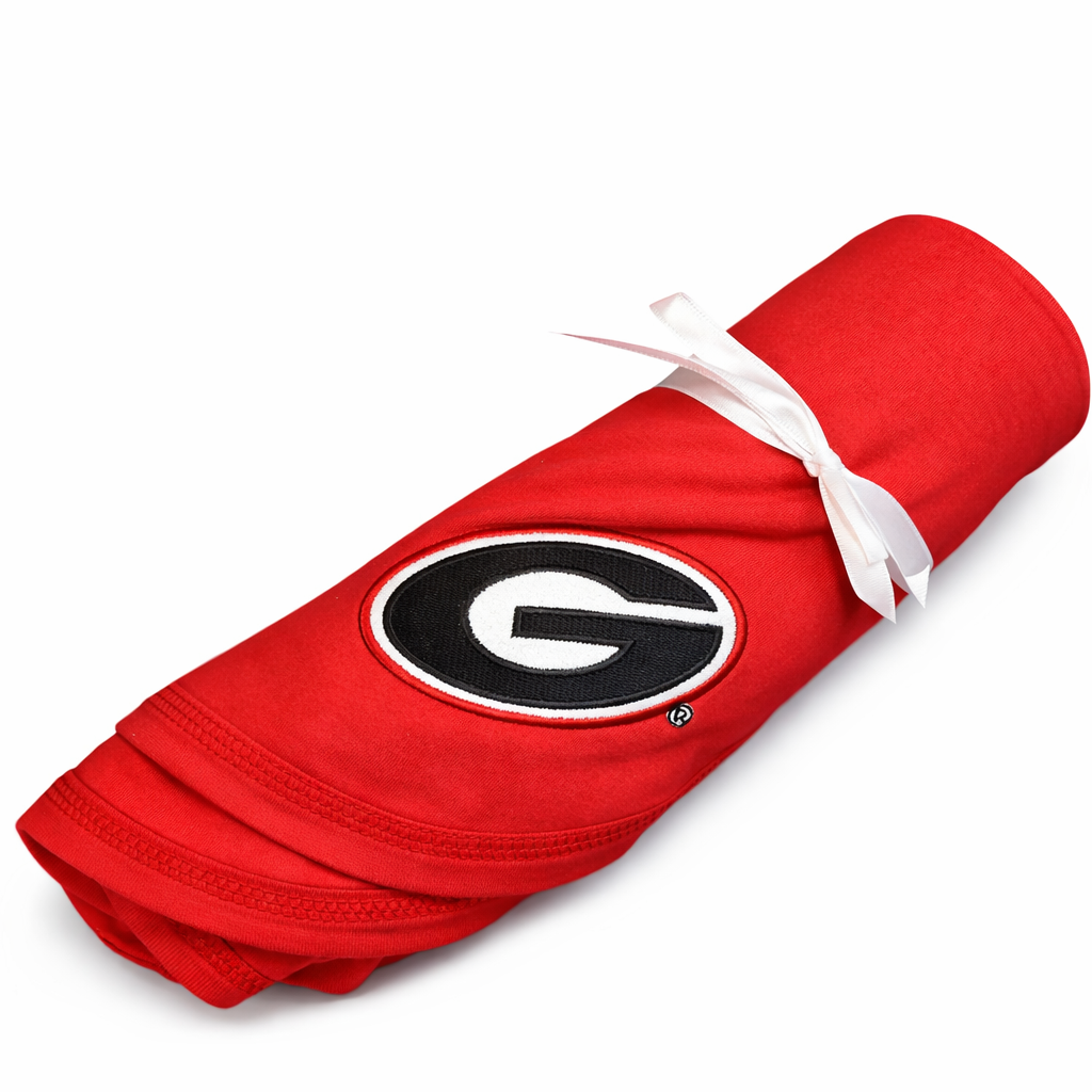 Red blanket with a black and white logo on a white background