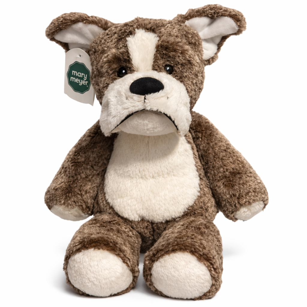 Brown and white plush dog toy with a visible brand tag on a white background