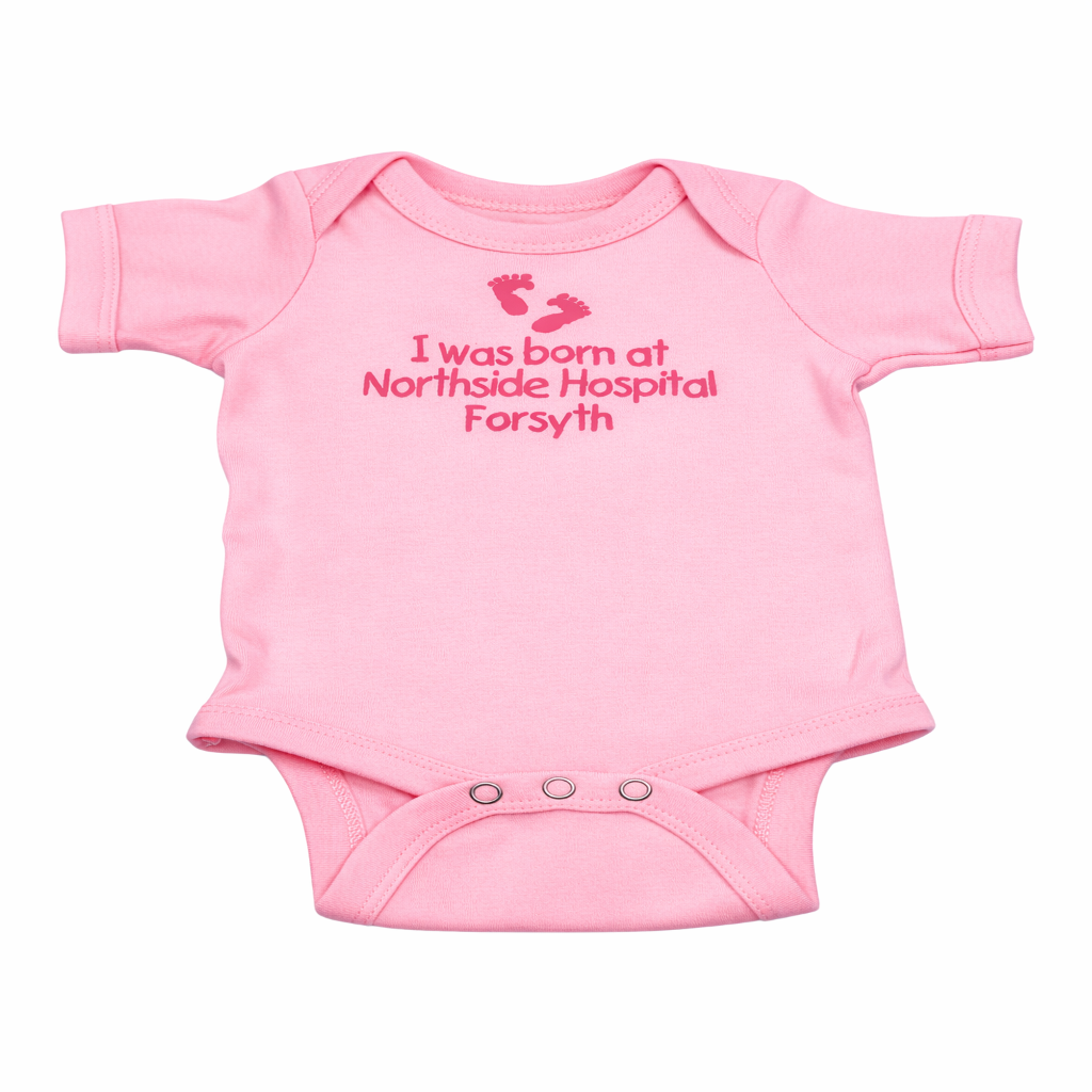 Pink baby onesie with text on a white background